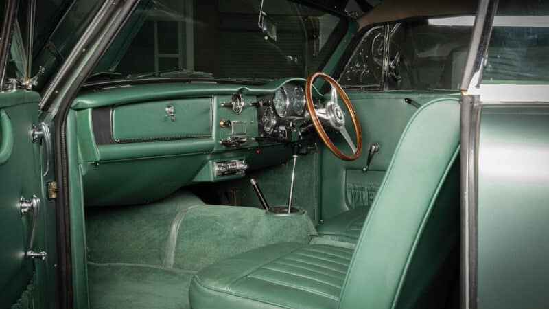 Luxurious interior is beautifully trimmed in Fern Green leather with wool carpets