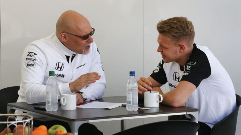 Matt Bishop, McLaren chief of comms, offering Kevin Magnussen some avuncular advice in 2015