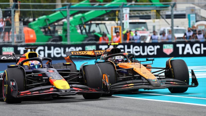 Max Verstappen (Red Bull-Honda) and Lando Norris (McLaren-Mercedes) in a close fight during the 2025 Miami Grand Prix
