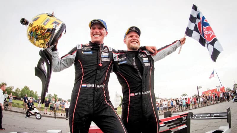 celebrating with IMSA Ganassi team-mate in Detroit in 2021