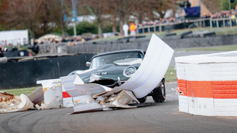 In the pre-1963 GT Moss Trophy, Jaguar E-type of Niall McFadden wipes out the chicane