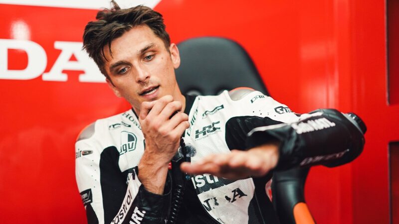 Luca Marini in debrief in Honda MotoGP pit garage