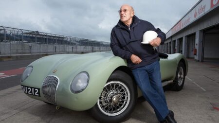 Stirling Moss drives his innovative disc brake Jaguar C-Type